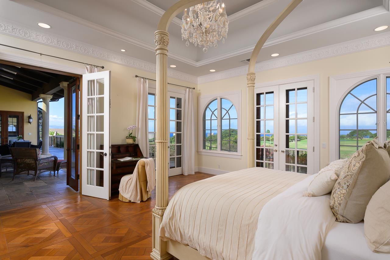 104 Anapuni Loop Lahaina, HI 96761 - Photo 22 of 45 a bedroom with a large bed and a large window