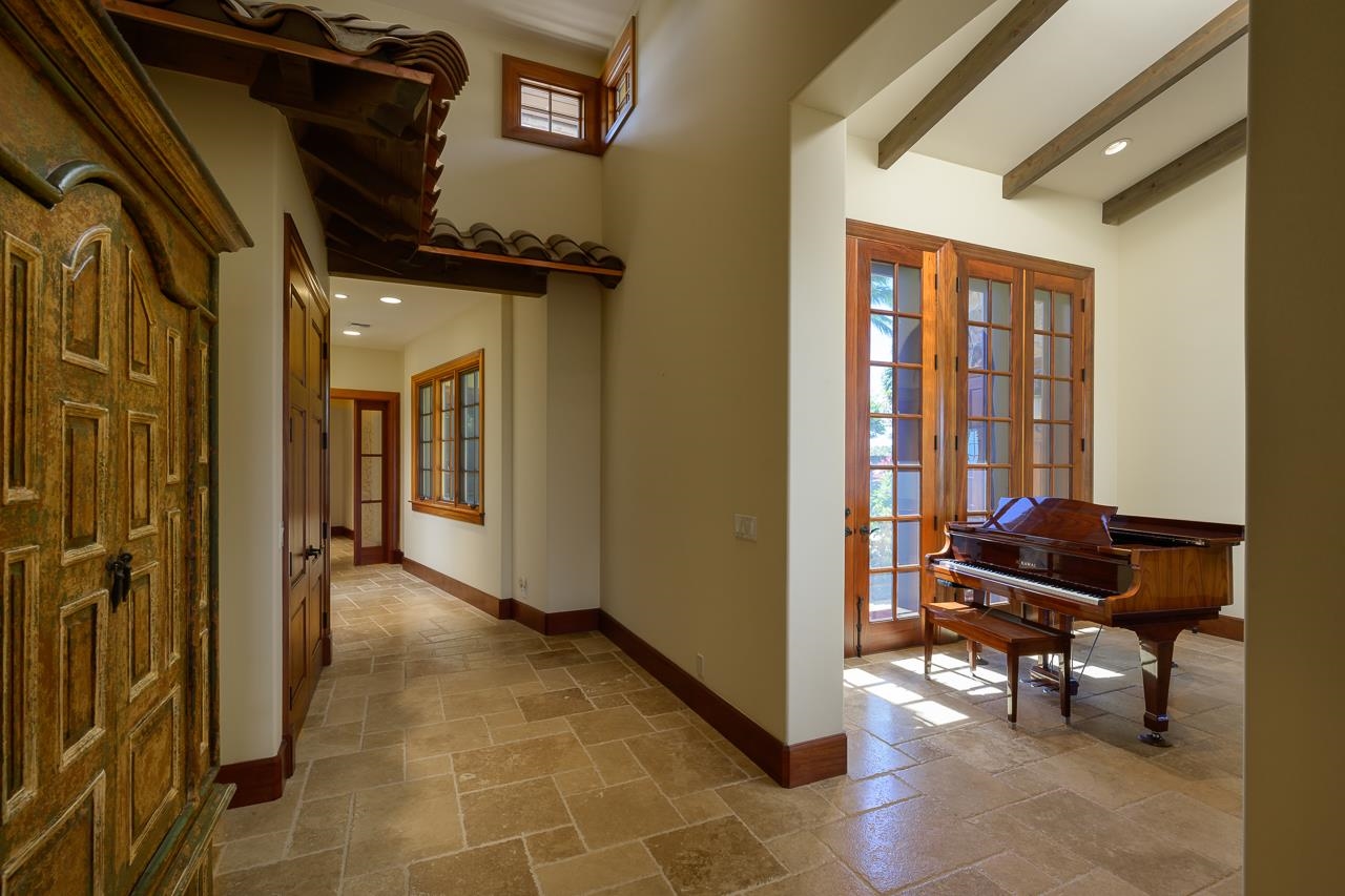 104 Anapuni Loop Lahaina, HI 96761 - Photo 32 of 45 a view of a hallway with furniture and a window