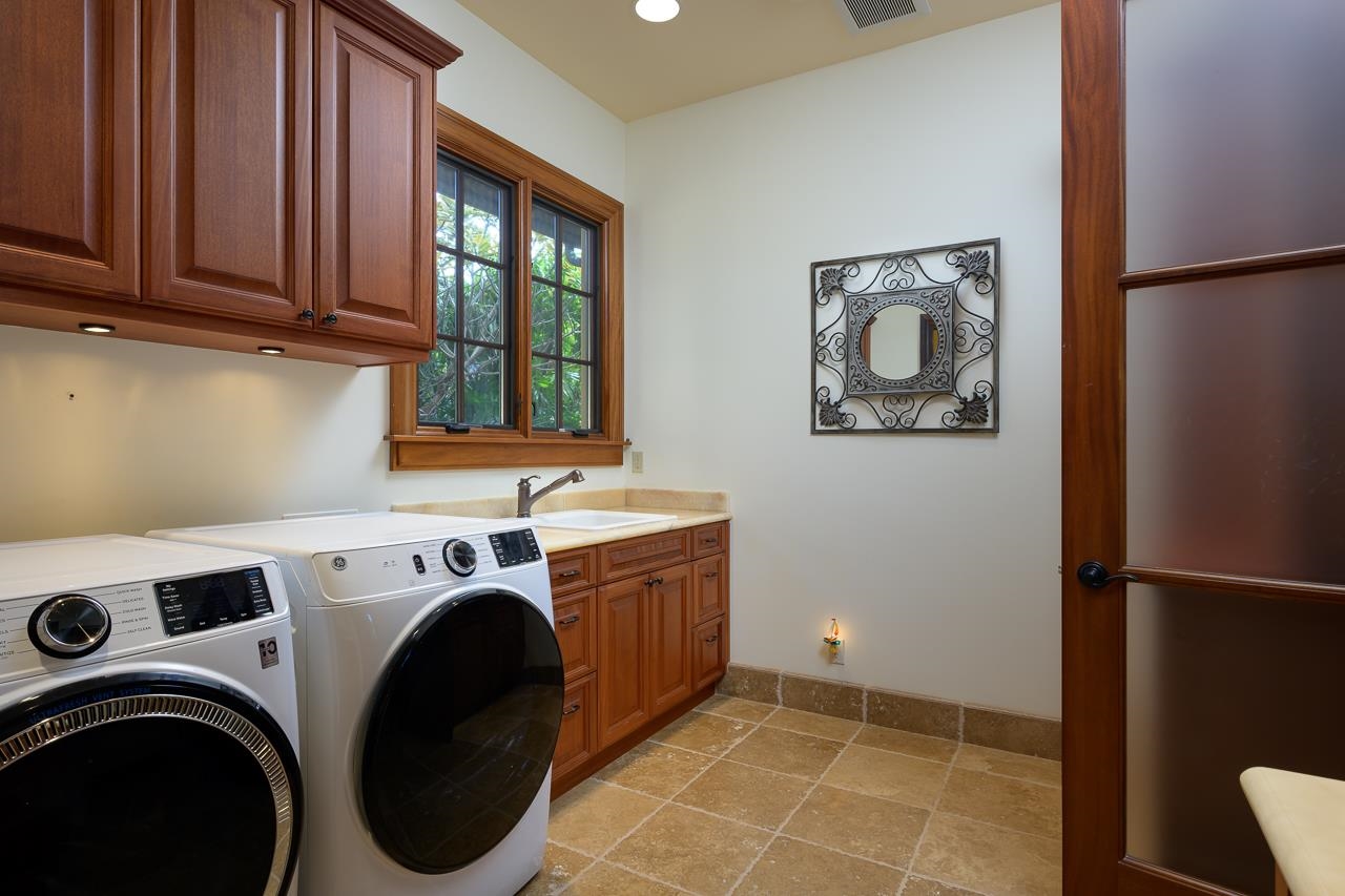 104 Anapuni Loop Lahaina, HI 96761 - Photo 37 of 45 a utility room with dryer and washer