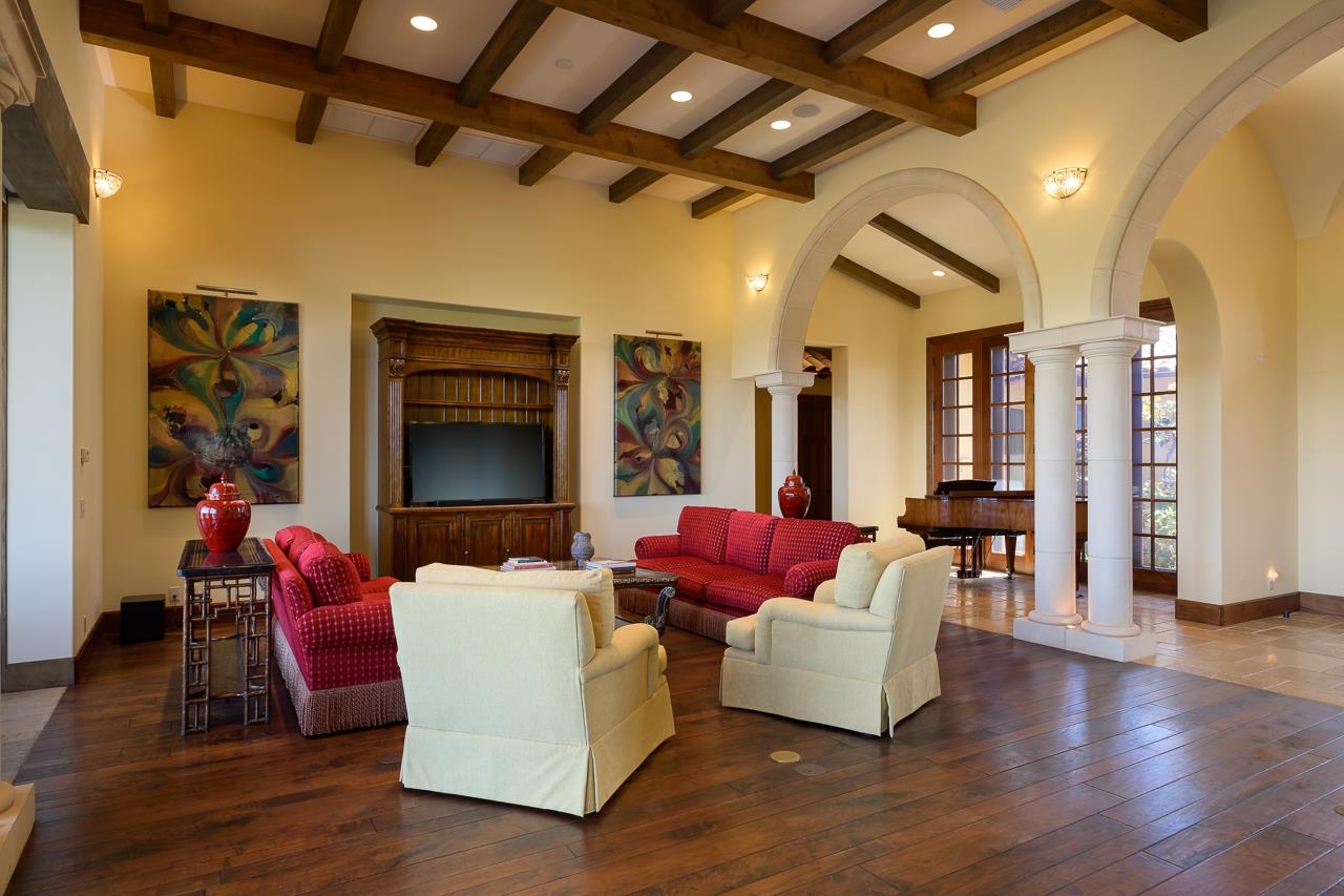 104 Anapuni Loop Lahaina, HI 96761 - Photo 6 of 45 a living room with furniture wooden floor and a fireplace