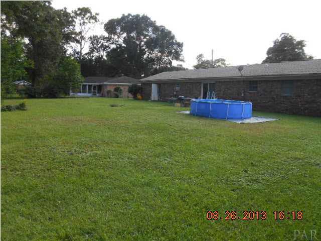 8408 Ridgefield Road Pensacola, FL 32514 - Photo 19 of 20 Large Fenced Back Yard. Pool will be removed.
