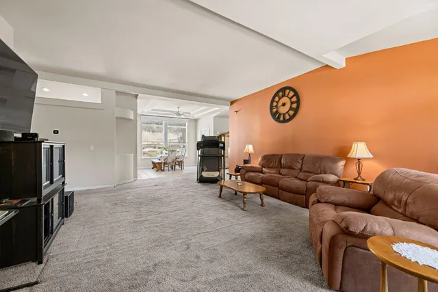 a kitchen with stainless steel appliances granite countertop a sink a stove and cabinets