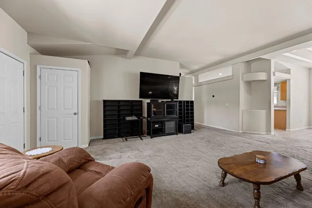 a kitchen with a sink window and cabinets