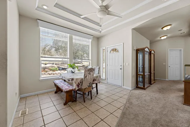 a bedroom with a bed and a television