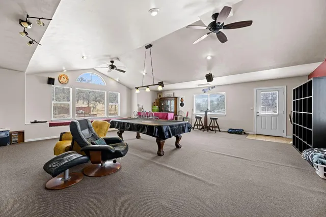 a view of balcony with two chairs and wooden floor