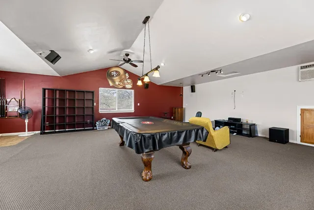 a view of a house with a large tree in front of it