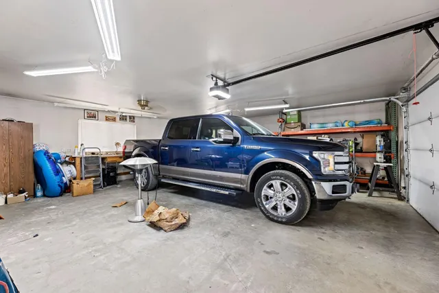 a view of a yard with wooden fence