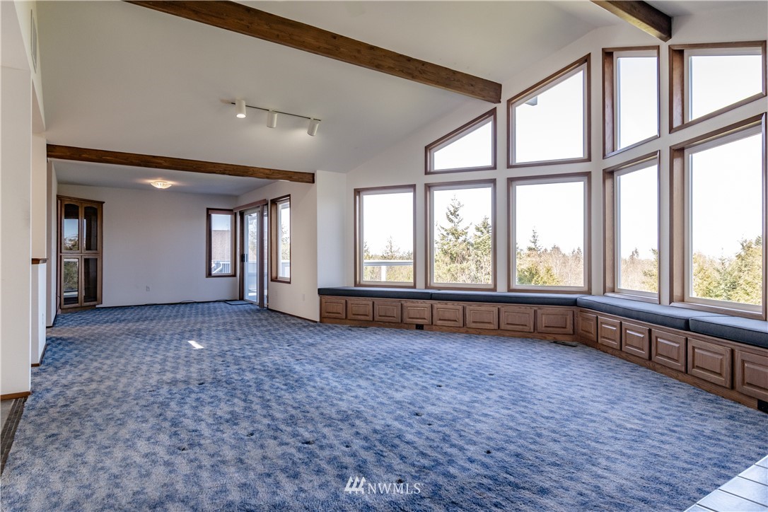 449 Guy Kelly Road Port Angeles, WA 98362 - Photo 12 of 40 wooden floor in an empty room with a window