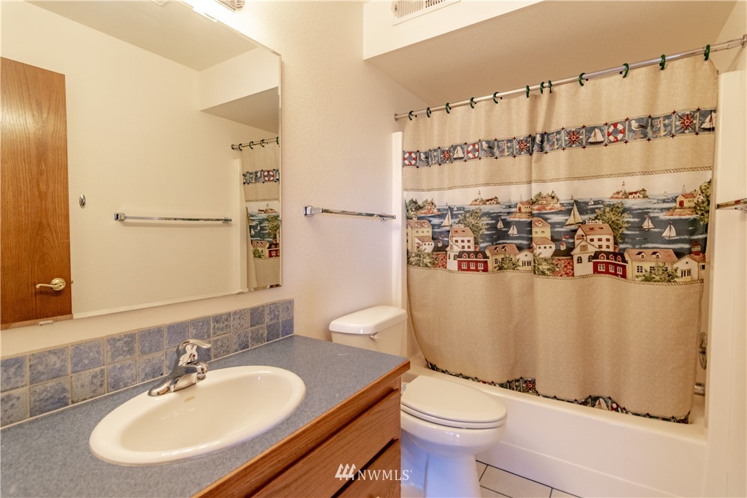 449 Guy Kelly Road Port Angeles, WA 98362 - Photo 25 of 40 a bathroom with a sink toilet and shower