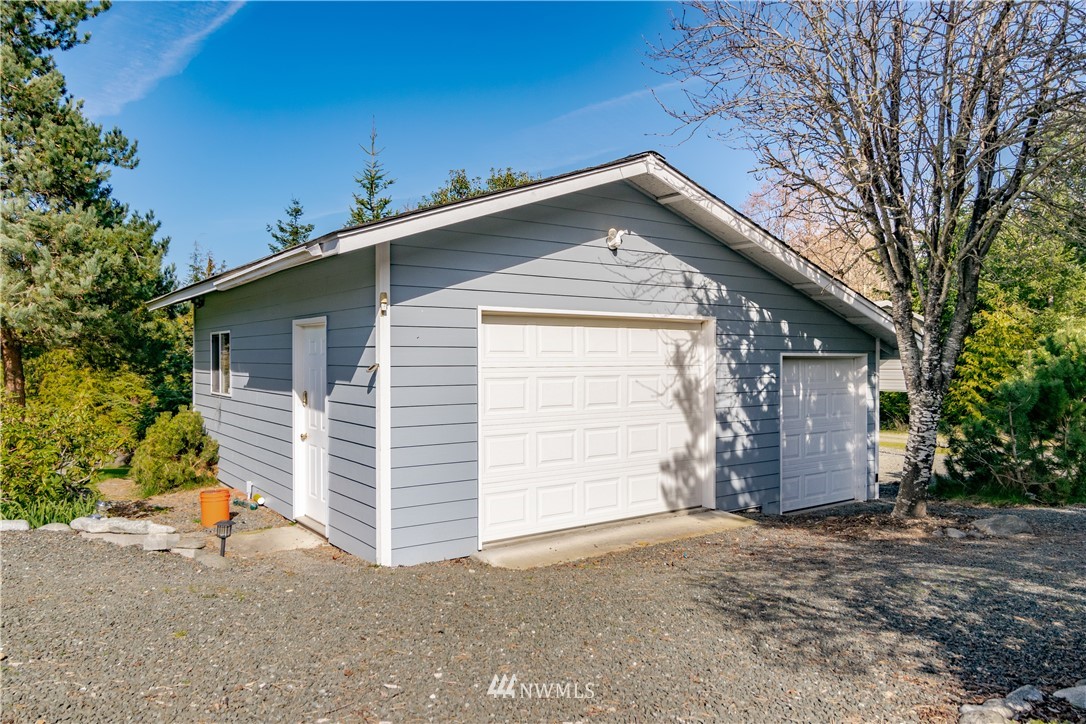 449 Guy Kelly Road Port Angeles, WA 98362 - Photo 33 of 40 a view of a house with a yard and garage