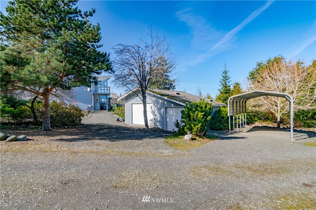 449 Guy Kelly Road Port Angeles, WA 98362 - Photo 35 of 40 a front view of a house with a yard and a garage