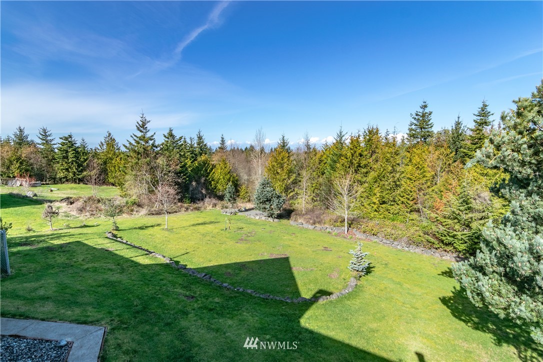 449 Guy Kelly Road Port Angeles, WA 98362 - Photo 39 of 40 a view of a golf course with a lake