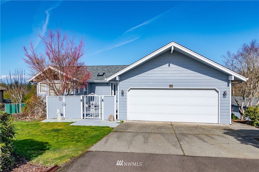 449 Guy Kelly Road Port Angeles, WA 98362 - Photo 8 of 40 a front view of a house with a yard and garage