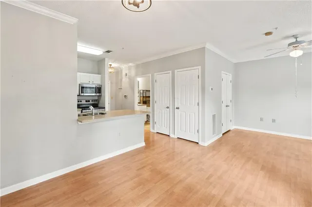 a view of an empty room with a window