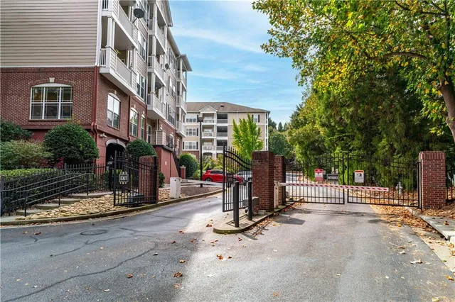 a view of a house with swimming pool and sitting area
