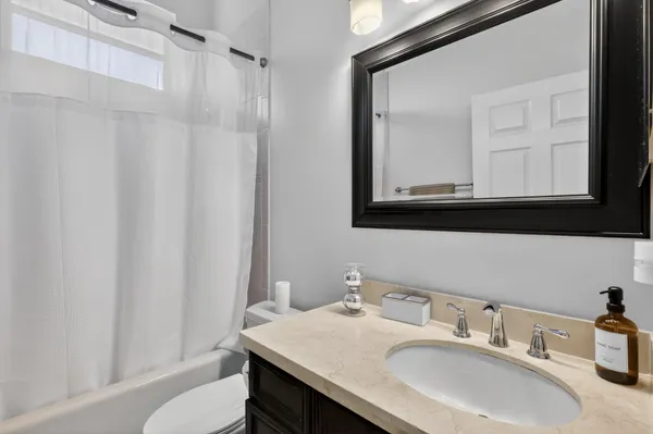 a bathroom with a bathtub and a toilet