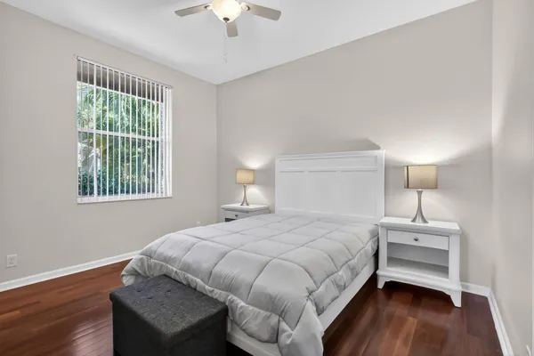 a bedroom with a bed and a lamp