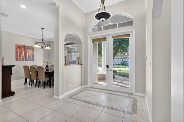 a living room with a rug table and a large window