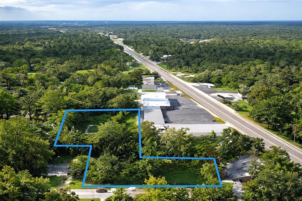 940 Northeast 35th Street Ocala, FL 34479 - Photo 2 of 7 a view of a city with lush green forest