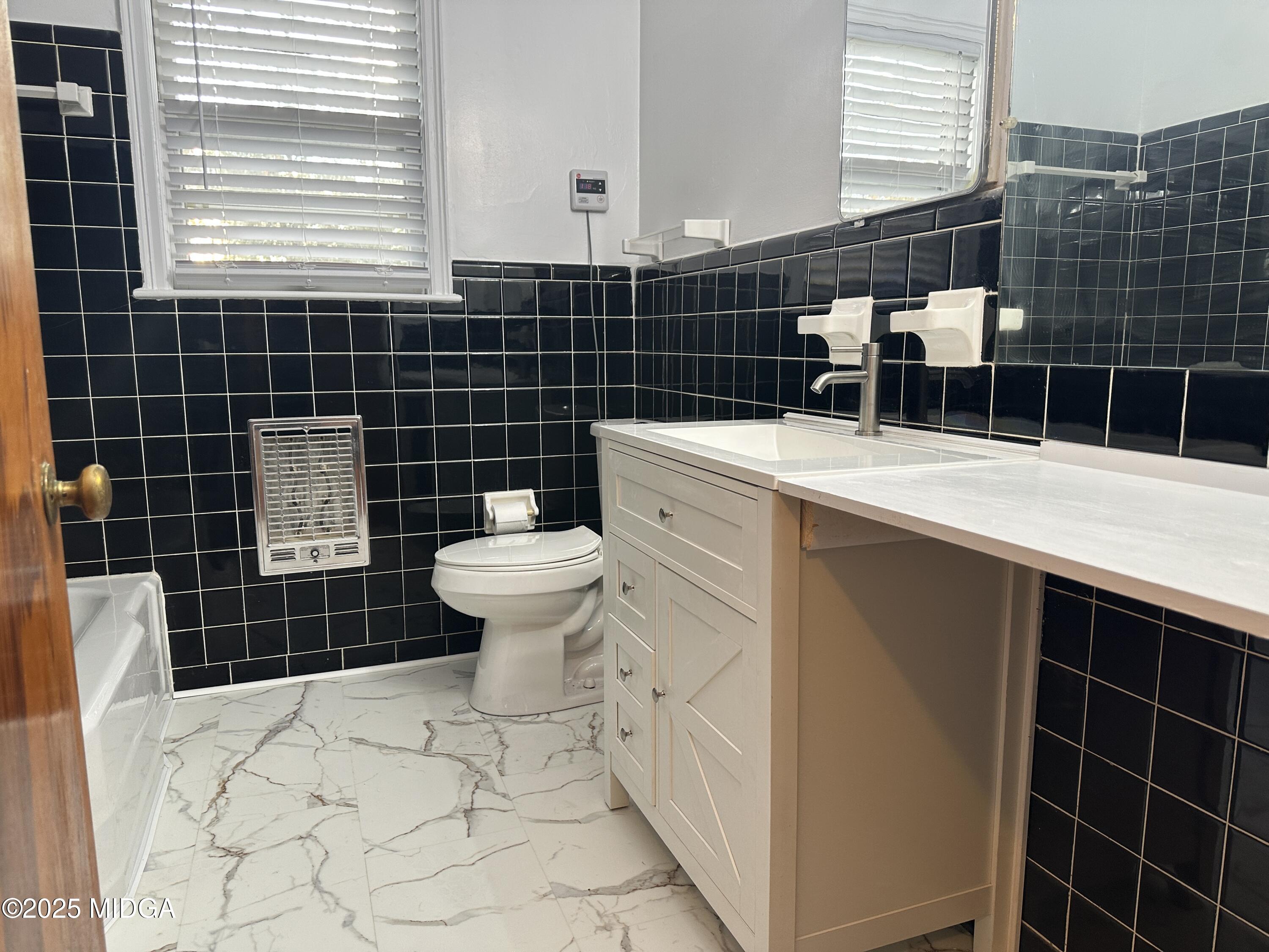 2526 Old Holton Road Macon, GA 31204 - Photo 11 of 19 a bathroom with a sink toilet and shower