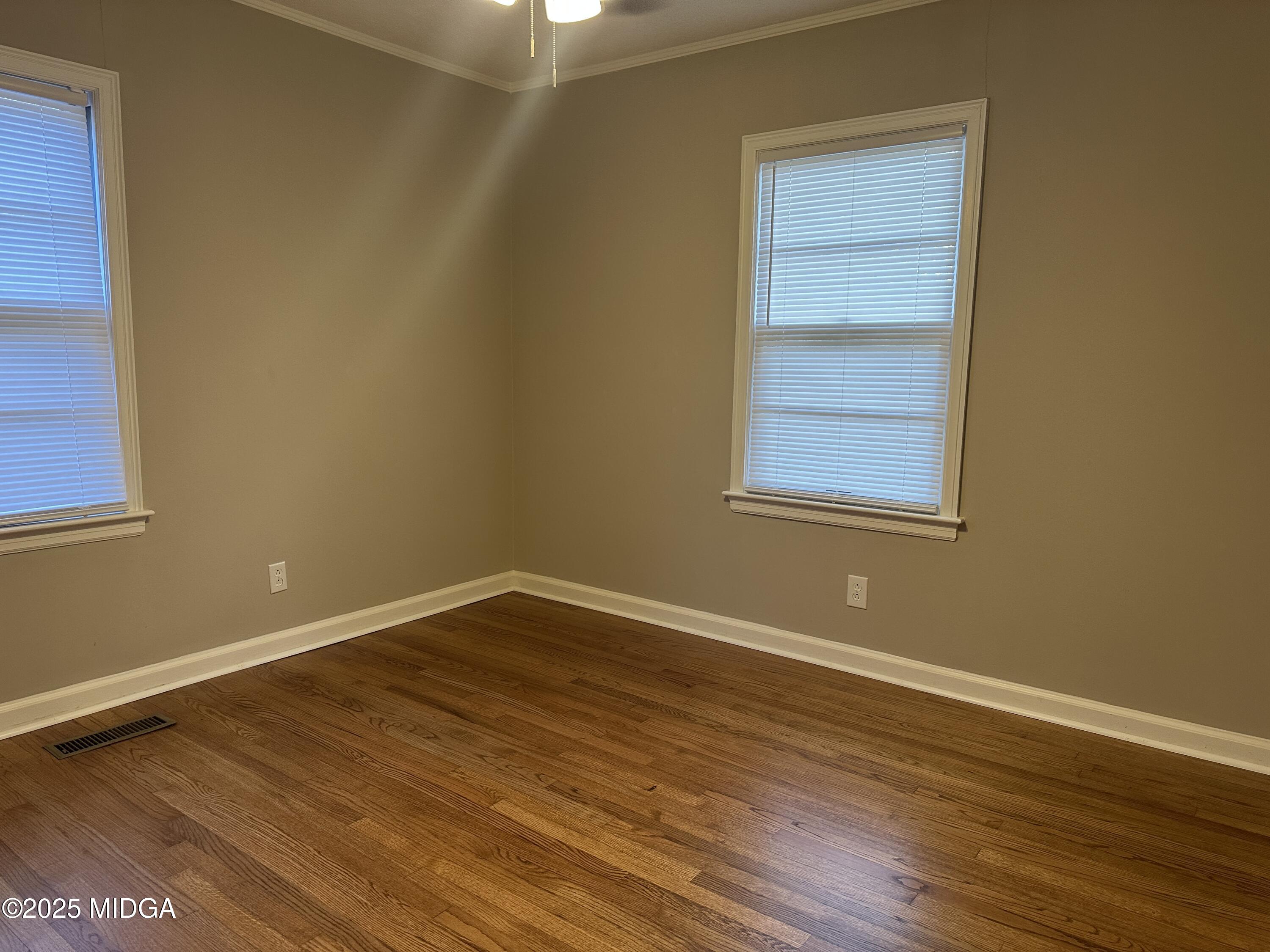 2526 Old Holton Road Macon, GA 31204 - Photo 13 of 19 a view of an empty room with wooden floor and a window