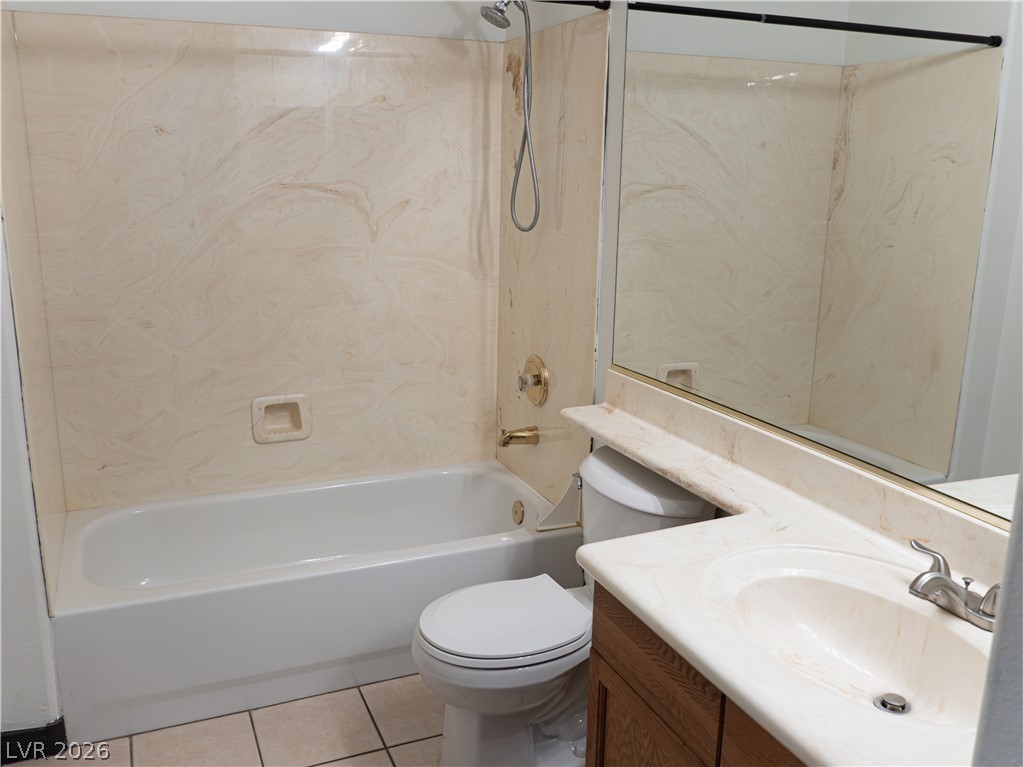 1466 Orange Jubilee Road Henderson, NV 89014 - Photo 7 of 15 Functional bathroom featuring a tub-shower combo and a single vanity with ample counter space.