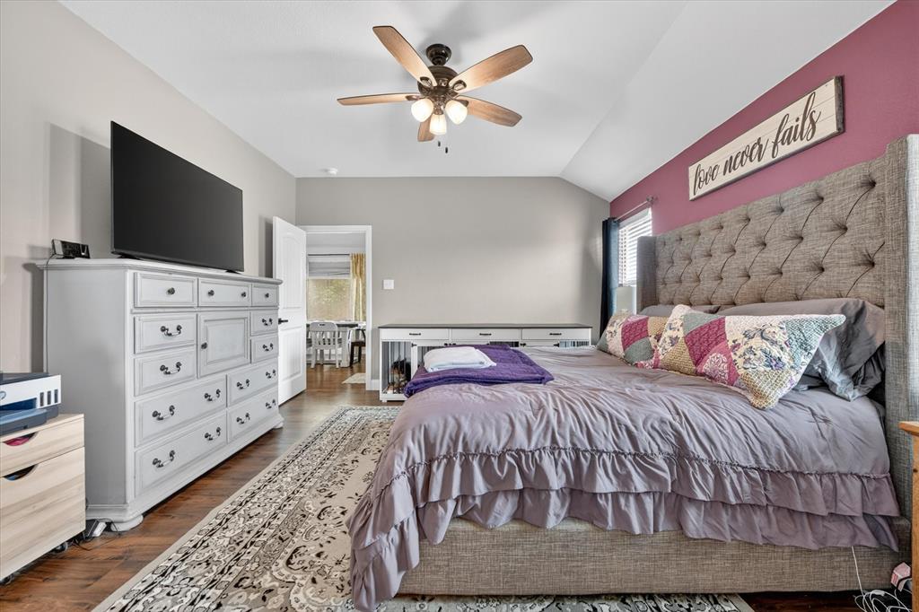 833 Rutherford Drive Crowley, TX 76036 - Photo 19 of 30 Spacious Primary Bedroom with Fan and Hard Wood Floor