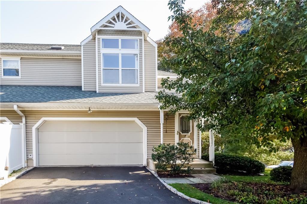 a front view of a house with a garage