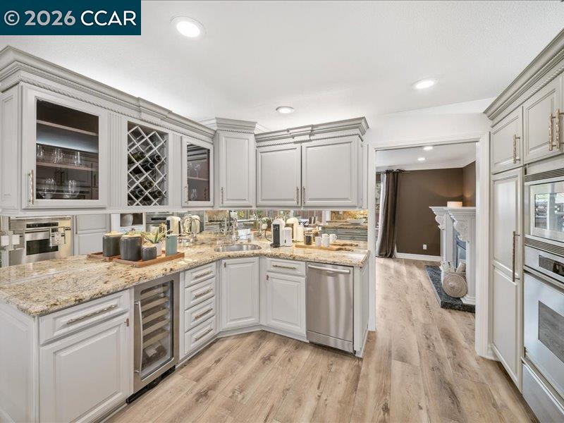 400 Fernando Court San Ramon, CA 94583 - Photo 11 of 38 a kitchen with stainless steel appliances granite countertop a sink stove and refrigerator