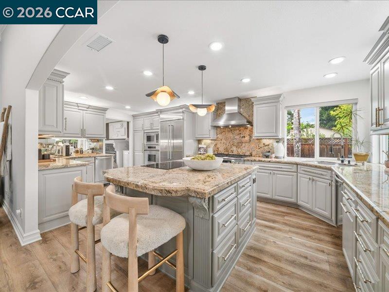 400 Fernando Court San Ramon, CA 94583 - Photo 8 of 38 a kitchen with stainless steel appliances granite countertop a stove a sink a oven and a refrigerator
