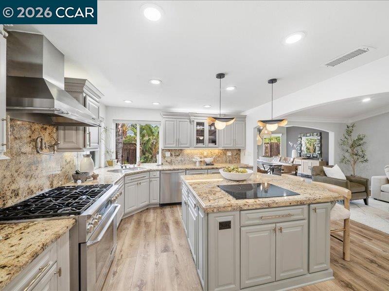 400 Fernando Court San Ramon, CA 94583 - Photo 10 of 38 a kitchen with a stove sink and cabinets