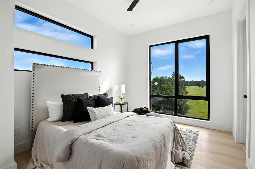 4611 Fairmount Street, Unit 102 Dallas, TX 75219 - Photo 12 of 25 a bedroom with a bed and window