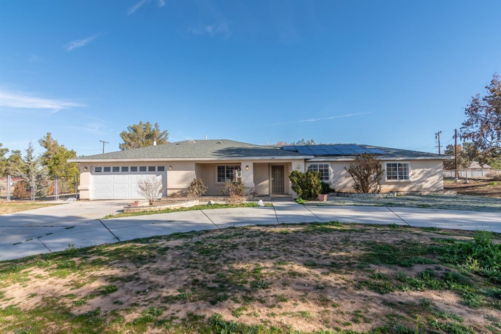 13505 Anoka Road Apple Valley, CA 92308 - Photo 1 of 1 a view of a house with a yard and sitting area