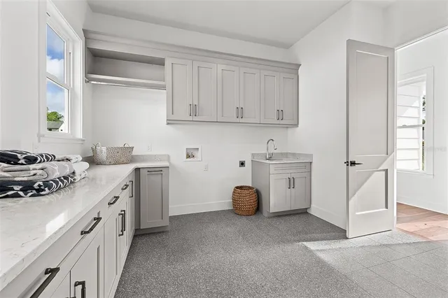 a kitchen with a white cabinets and white appliances