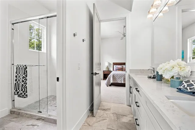 a bedroom with a bed and a mirror