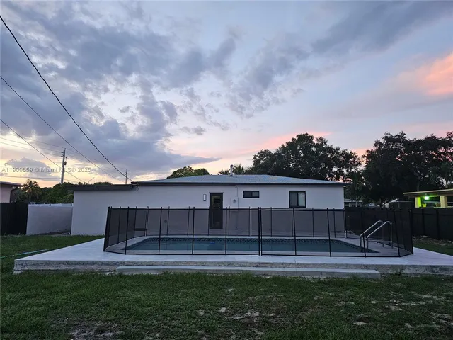 a view of house with backyard and entertaining space