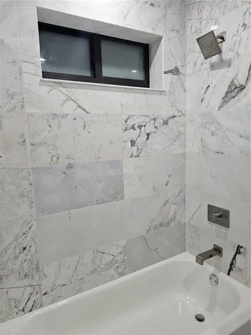 a bathroom with a sink and a shower