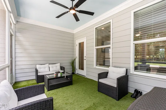 a living room with furniture and a window