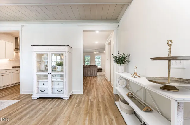 a view of a kitchen with a sink and cabinets