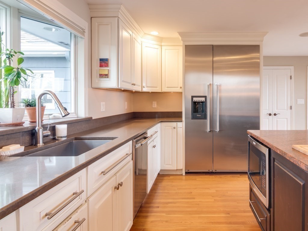128 Locksley Road Lynnfield, MA 01940 - Photo 12 of 38 a kitchen with granite countertop a refrigerator and a sink
