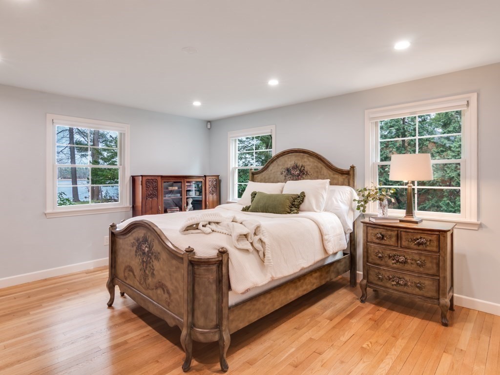 128 Locksley Road Lynnfield, MA 01940 - Photo 14 of 38 a bedroom with a bed and a dresser next to a window