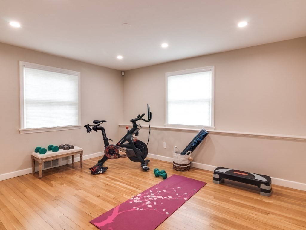 128 Locksley Road Lynnfield, MA 01940 - Photo 16 of 38 a view of a room with gym equipment and a window