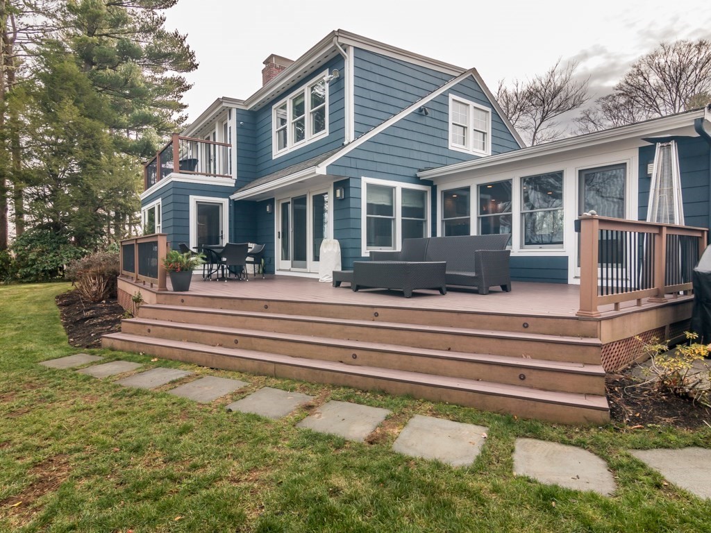 128 Locksley Road Lynnfield, MA 01940 - Photo 2 of 38 a front view of a house with a swimming pool
