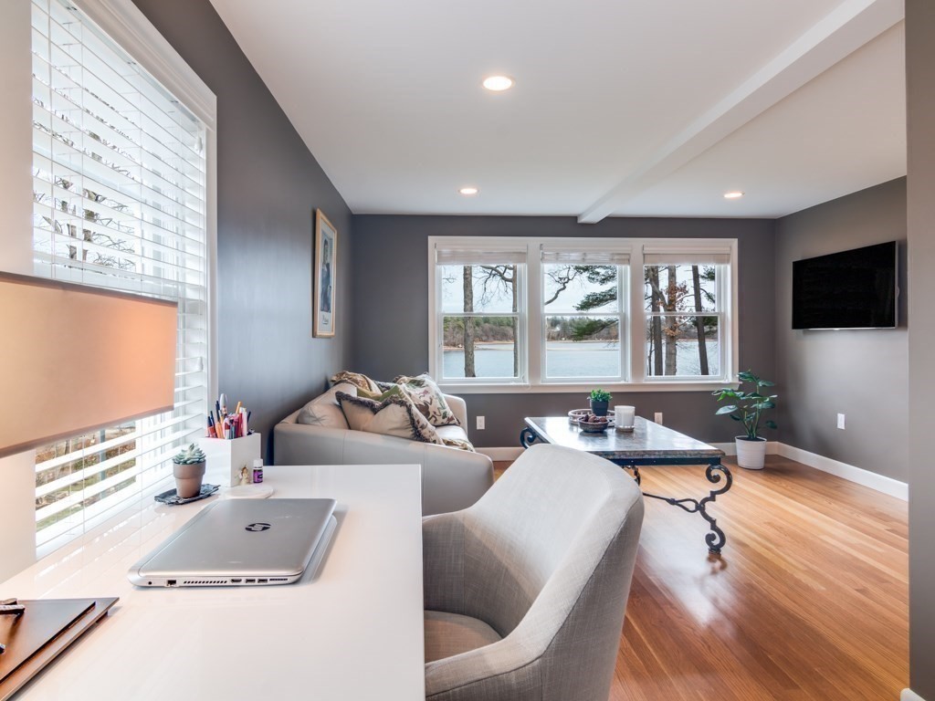 128 Locksley Road Lynnfield, MA 01940 - Photo 24 of 38 a living room with furniture and a flat screen tv