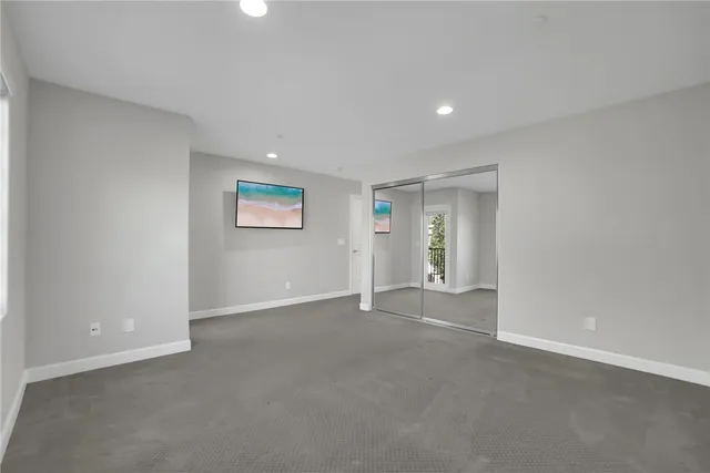 a bathroom with a bathtub shower sink vanity and toilet