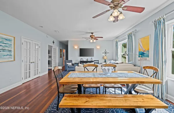 a kitchen with stainless steel appliances granite countertop table chairs and granite counter tops