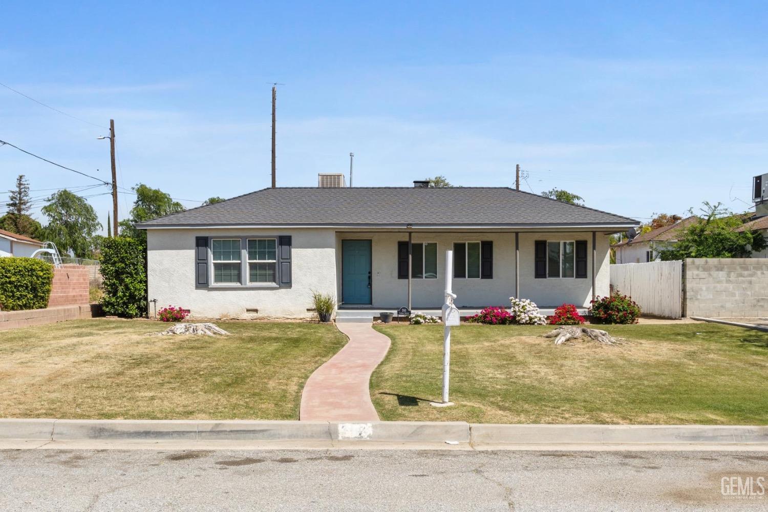 a view of a house with a swimming pool and sitting area