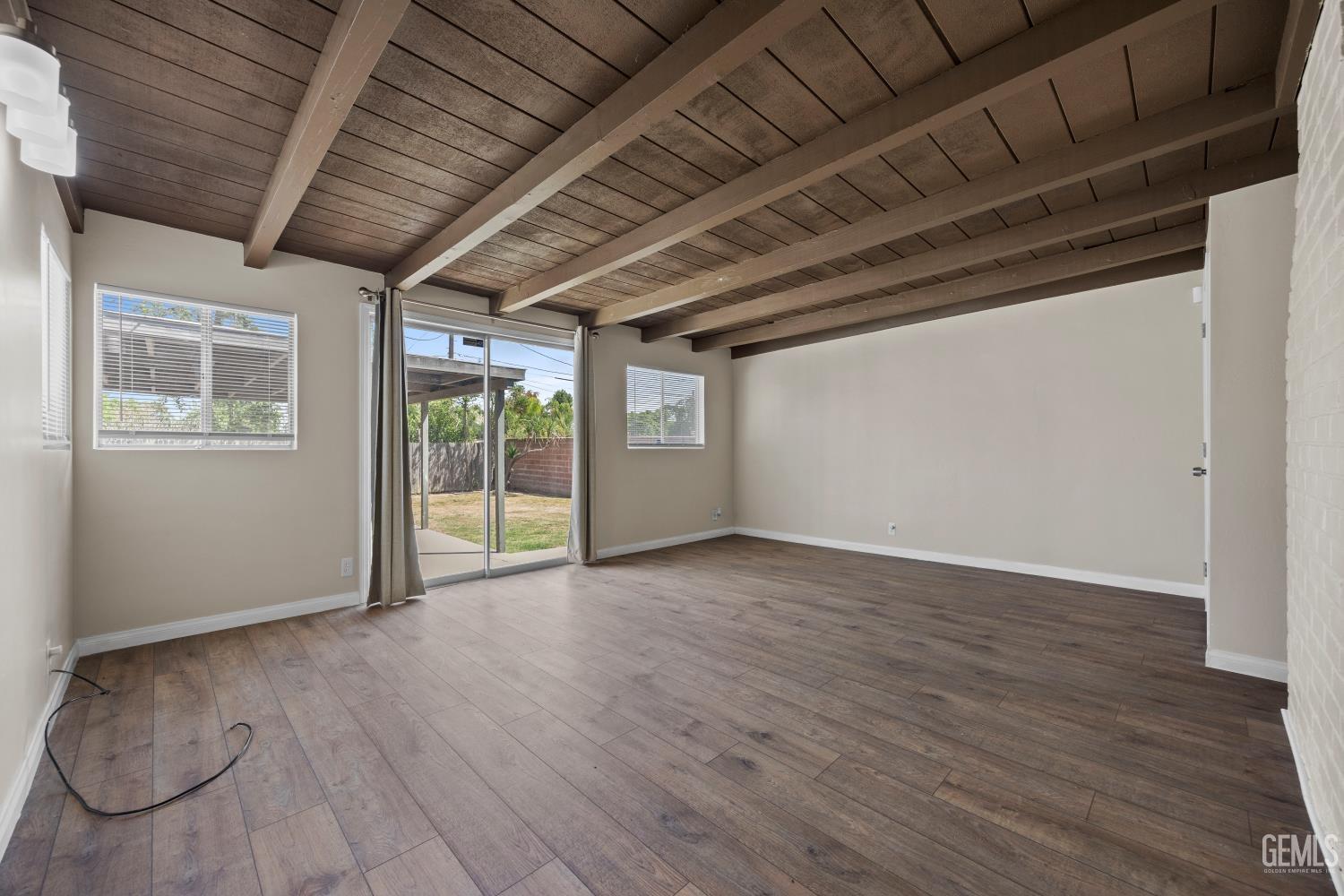 Undisclosed Address Bakersfield, CA 93305 - Photo 13 of 29 a view of livingroom with wooden floor
