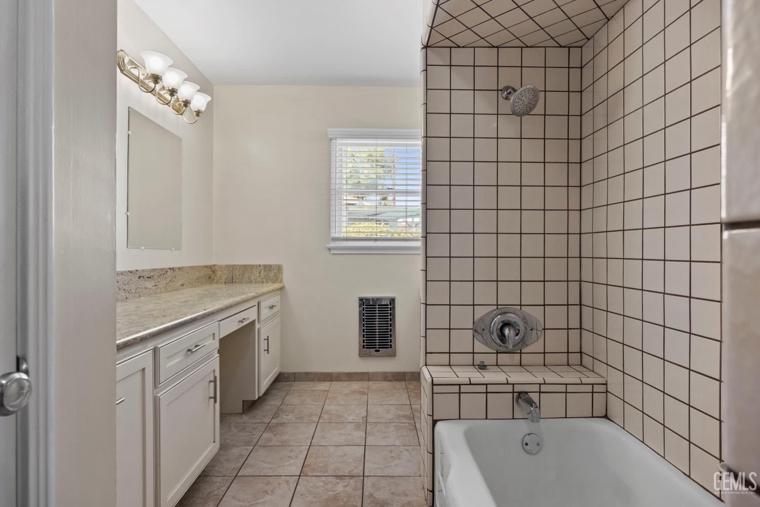 Undisclosed Address Bakersfield, CA 93305 - Photo 15 of 29 a bathroom with a tub a sink and a shower