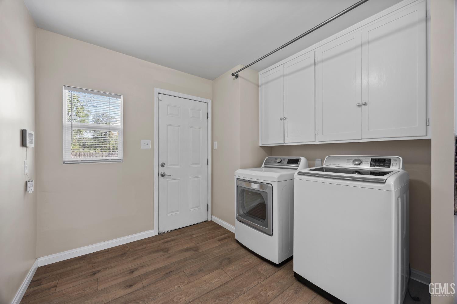 Undisclosed Address Bakersfield, CA 93305 - Photo 22 of 29 a view of a storage and utility room with washer and dryer